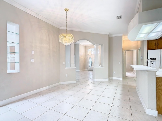 unfurnished dining area featuring visible vents, a notable chandelier, arched walkways, crown molding, and light tile patterned floors