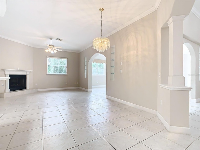 unfurnished living room featuring light tile patterned floors, a fireplace with raised hearth, arched walkways, and crown molding