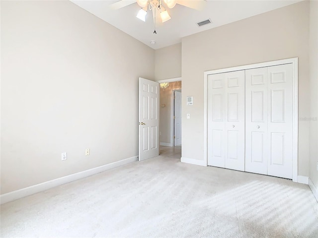 unfurnished bedroom featuring a ceiling fan, baseboards, visible vents, and a closet