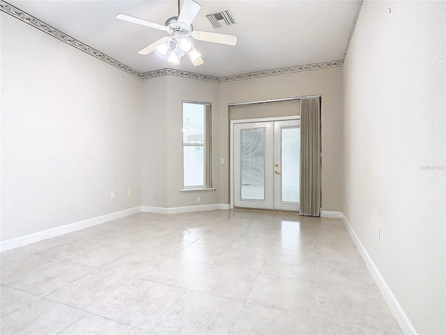 spare room featuring visible vents, french doors, light tile patterned floors, baseboards, and ceiling fan