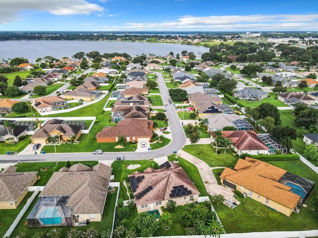 aerial view with a residential view and a water view