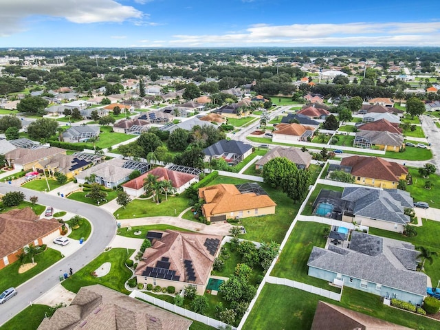 birds eye view of property with a residential view