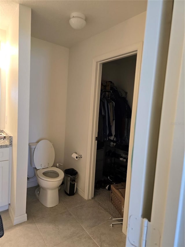 bathroom featuring toilet and tile patterned floors