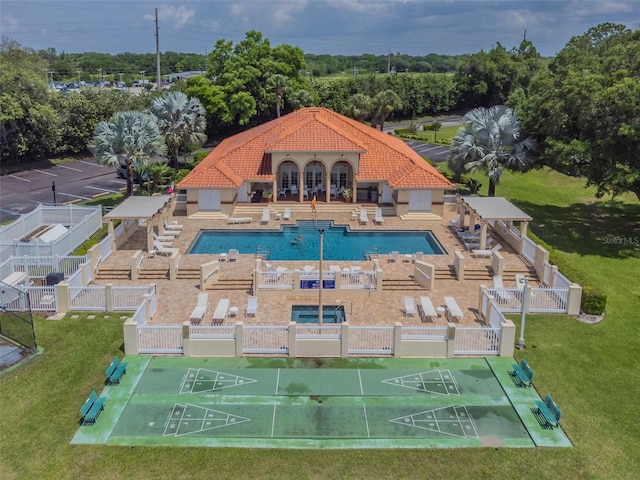 view of swimming pool featuring a lawn and a patio area