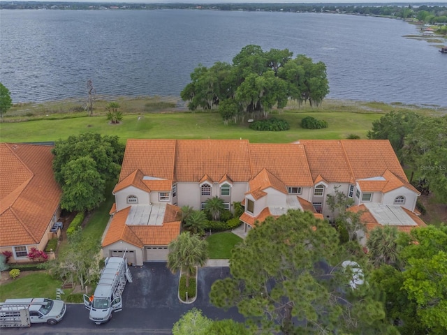 birds eye view of property featuring a water view