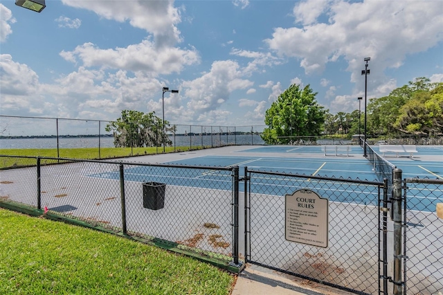 view of pool with tennis court