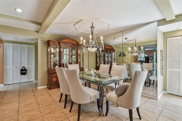 dining room with a notable chandelier, light tile patterned floors, and a textured ceiling