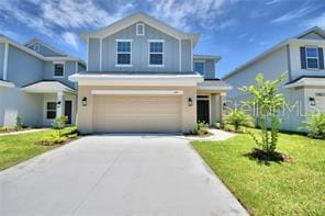 view of front of home featuring a garage and a front lawn