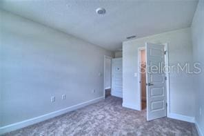 unfurnished bedroom with carpet