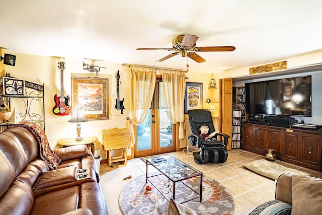 tiled living room featuring a textured ceiling, ceiling fan, and french doors