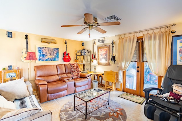 living room with ceiling fan, light tile patterned floors, and french doors