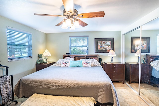 bedroom featuring ceiling fan and a closet