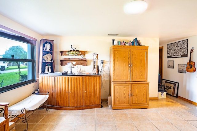 living area with light tile patterned floors