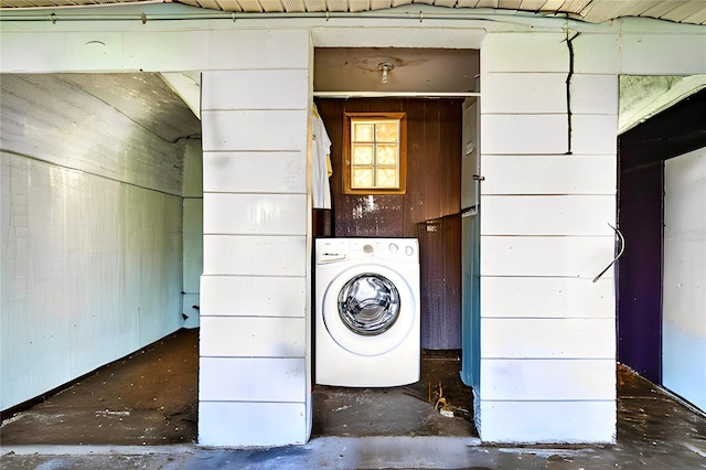 clothes washing area featuring washer / dryer