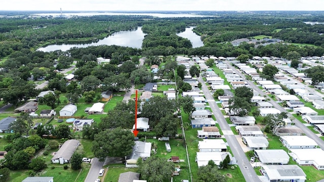4822 Melody Ln, Lakeland, FL 33805 - aerial overview of property's location featuring a large body of water, nearby suburban area, and a heavily wooded area