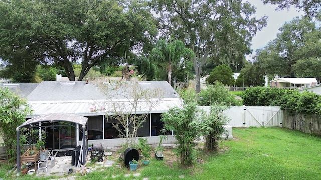 back of property featuring a lawn and a patio area