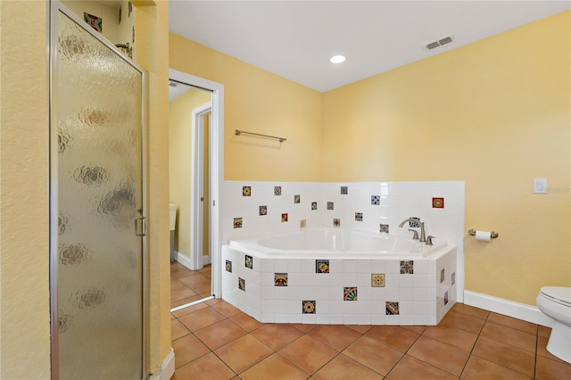 bathroom featuring separate shower and tub, toilet, and tile patterned floors