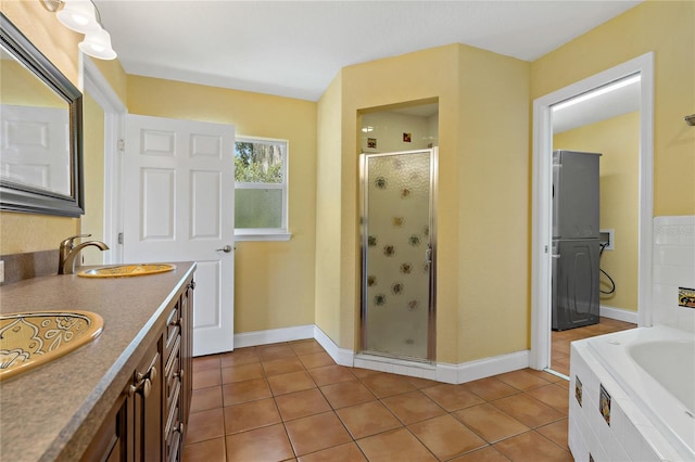 bathroom with vanity, independent shower and bath, and tile patterned flooring