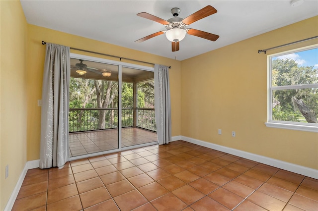 unfurnished room with ceiling fan and light tile patterned floors