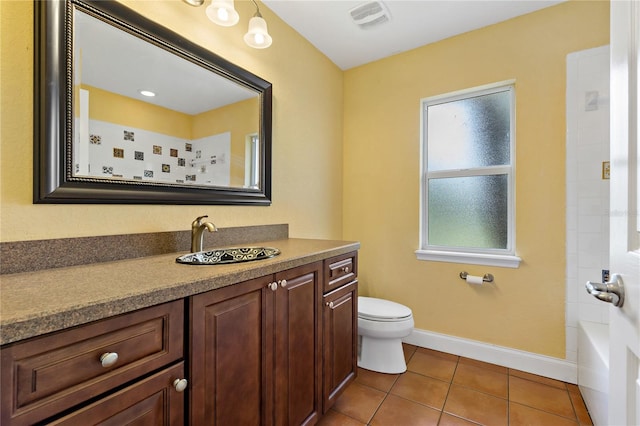 full bathroom featuring vanity, toilet, shower with separate bathtub, and tile patterned flooring