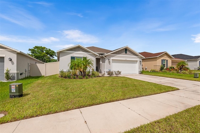 view of front of house featuring a garage and a front lawn