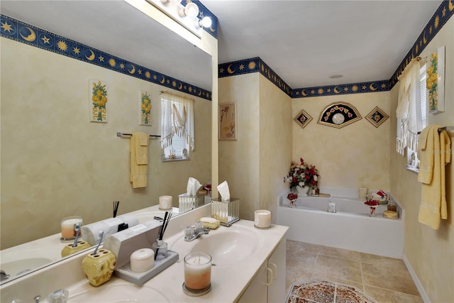 bathroom with a wealth of natural light, vanity, a bathing tub, and tile patterned flooring