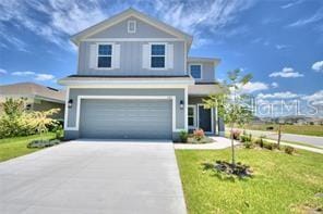 view of front facade with a garage and a front yard