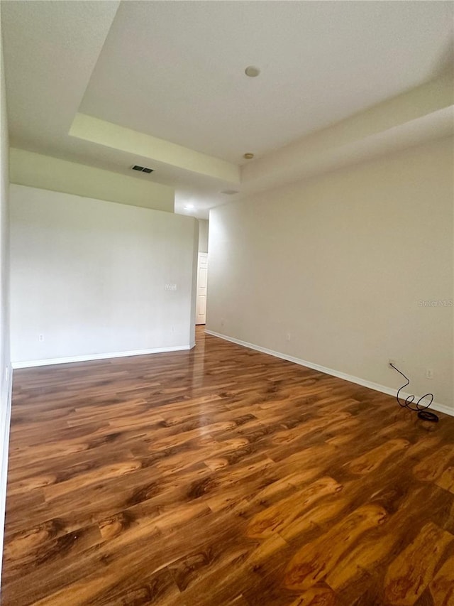 unfurnished room featuring dark hardwood / wood-style flooring