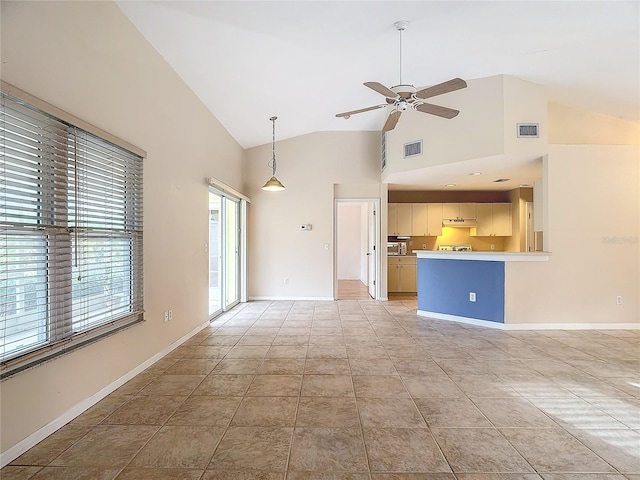 unfurnished living room with high vaulted ceiling, ceiling fan, and light tile patterned floors