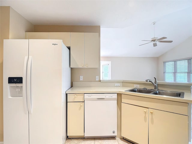 kitchen with white appliances, vaulted ceiling, sink, and ceiling fan