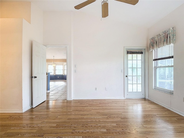 unfurnished room with ceiling fan and hardwood / wood-style flooring