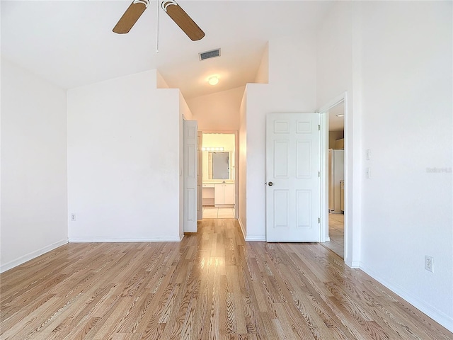 unfurnished room featuring ceiling fan, light hardwood / wood-style floors, and high vaulted ceiling