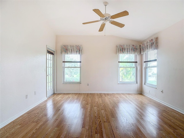 unfurnished room featuring light hardwood / wood-style flooring, a wealth of natural light, lofted ceiling, and ceiling fan