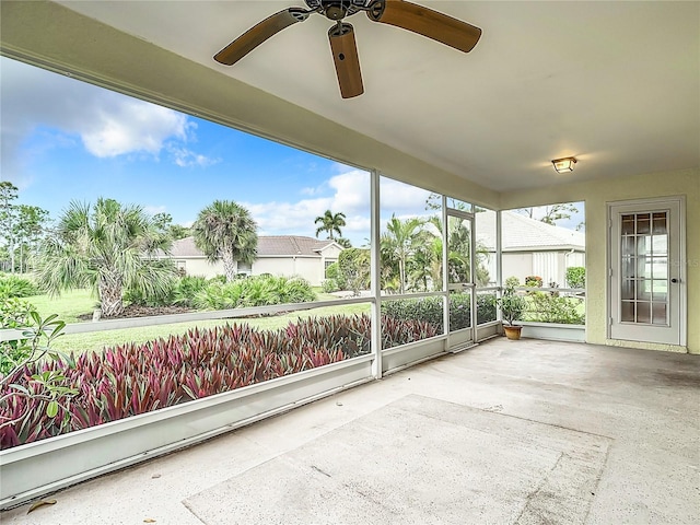 sunroom / solarium with ceiling fan