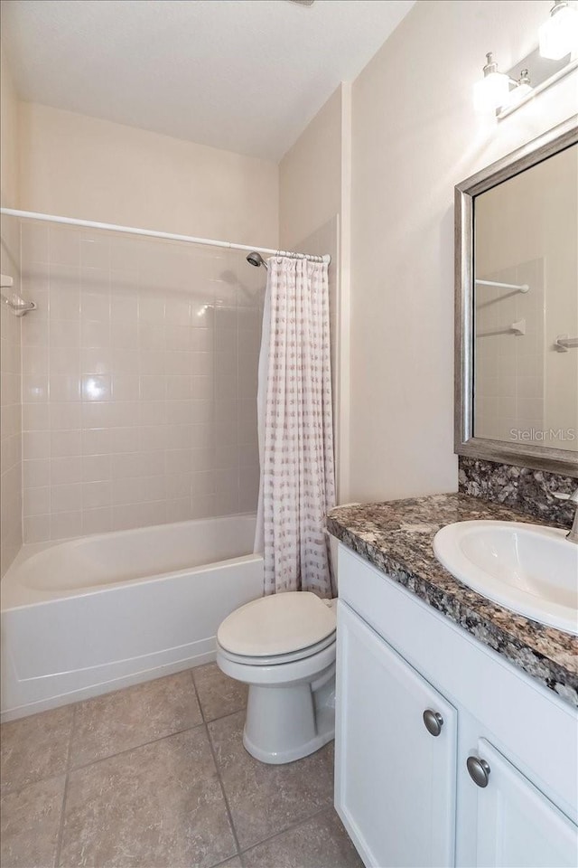 bathroom featuring toilet, shower / tub combo, tile patterned floors, and vanity