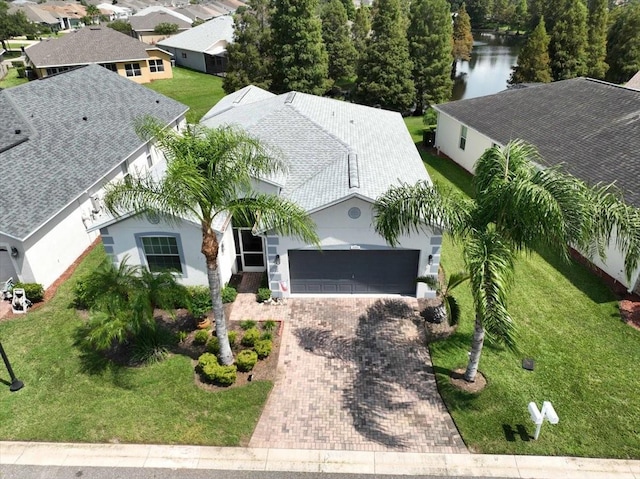 birds eye view of property with a water view