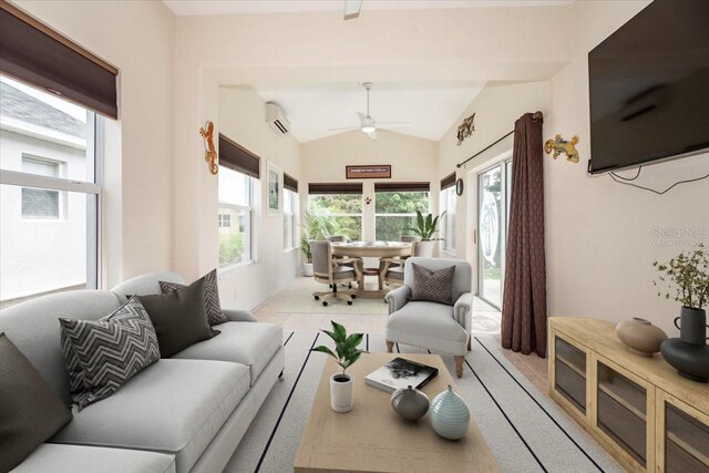 living room featuring plenty of natural light, an AC wall unit, vaulted ceiling, and ceiling fan