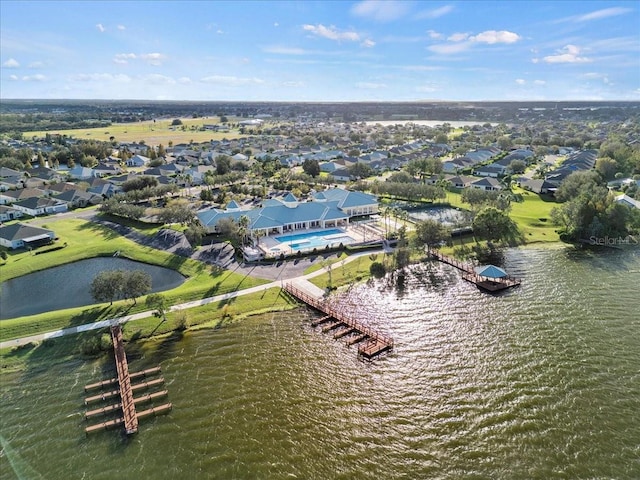 birds eye view of property with a water view and a residential view