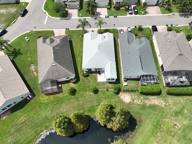 bird's eye view featuring a residential view and a water view