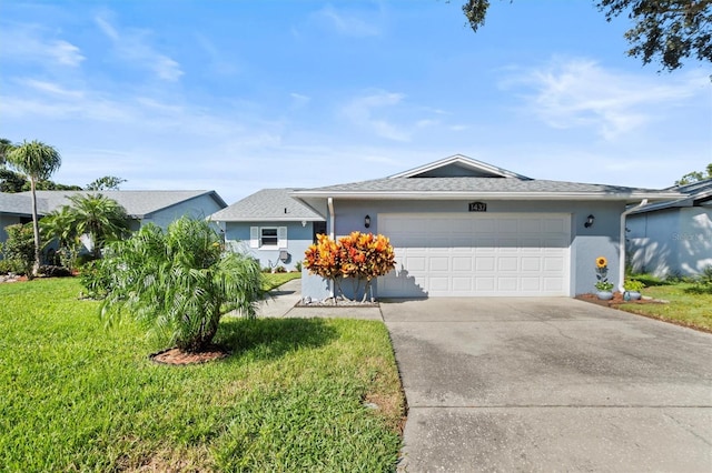 ranch-style house featuring a garage and a front yard