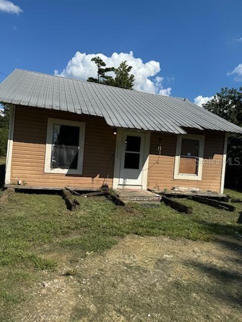 16203 SE Pear St, Blountstown, FL 32424 - view of front of home featuring a front yard and metal roof