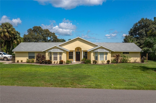 ranch-style house with a front lawn