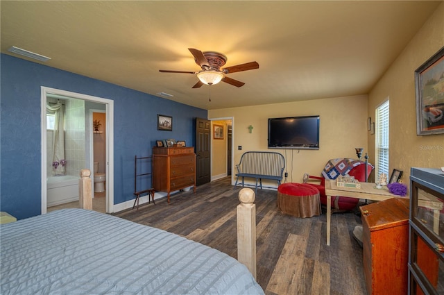 bedroom featuring ceiling fan, dark hardwood / wood-style floors, and ensuite bathroom