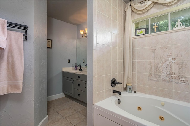 bathroom with vanity, tile patterned flooring, and a washtub