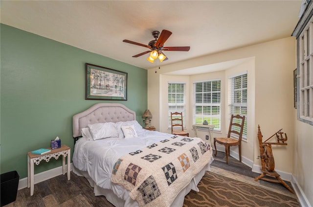 bedroom with ceiling fan and dark wood-type flooring