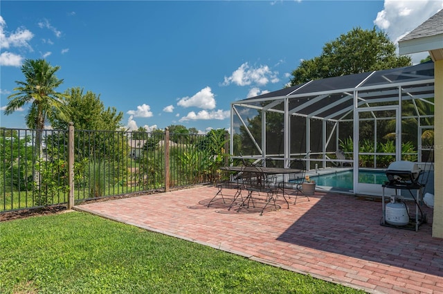 view of patio featuring a lanai, a fenced in pool, and grilling area