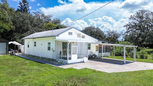 rear view of house featuring a lawn