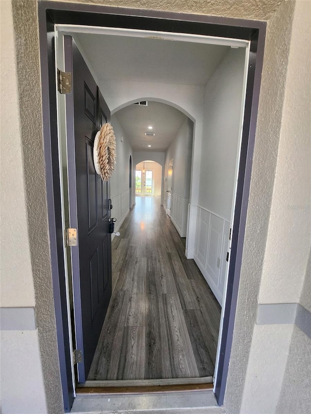 hall with hardwood / wood-style floors