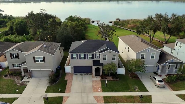 birds eye view of property featuring a water view