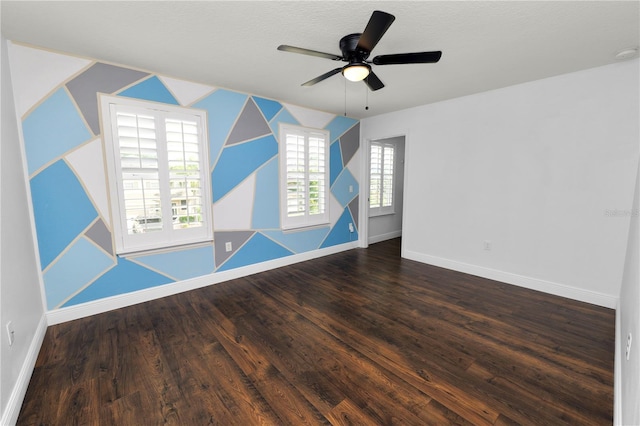 interior space featuring ceiling fan and dark hardwood / wood-style floors